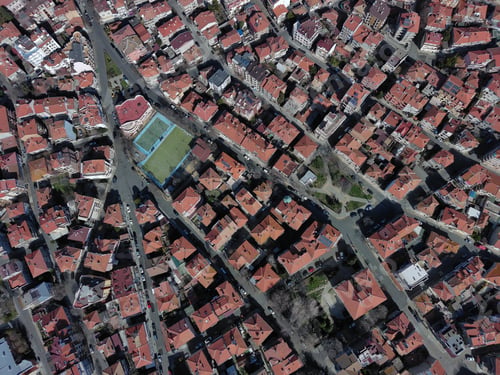 Preview: View from a height of the city of Pomorie with many cars, houses and hotels