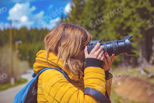 Preview: Woman Using Dslr In Mountain / Suburb Surroundings.