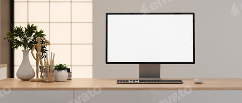 Preview: White screen computer with drawing figure and painting brushes aside vase and plant on wooden table.