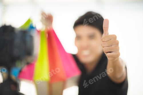 Preview: online sale social media marketing, young Asian man working with camera to live streaming to sale