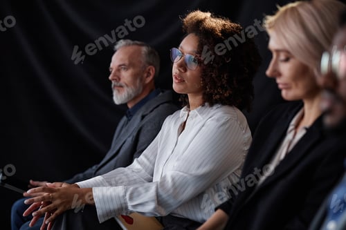 Preview: Focused Female Expert Participating in Business Meeting in Auditorium