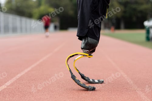 Preview: Athlete with prosthetic legs on a running track