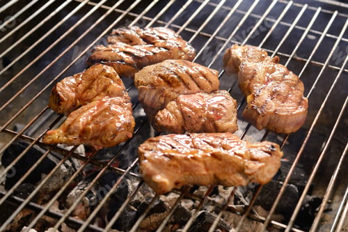 Preview: Grilled meat /steak on a grilled with smoke