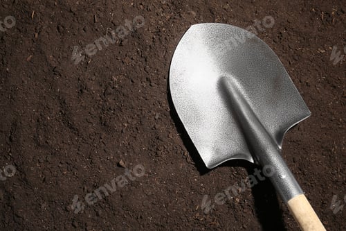 Preview: Metal shovel on fertile soil, top view and space for text. Gardening tool