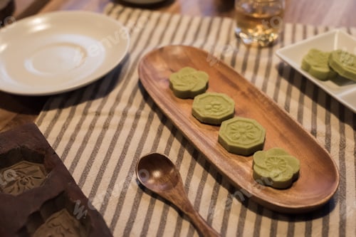 Preview: Green Mooncake On Table At Chinese Mid Autumn Festival