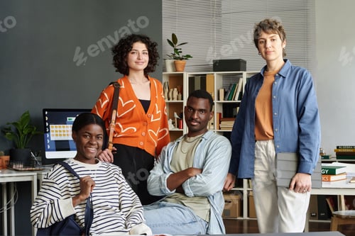 Preview: Group of Diverse Professionals Posing in Office Setting