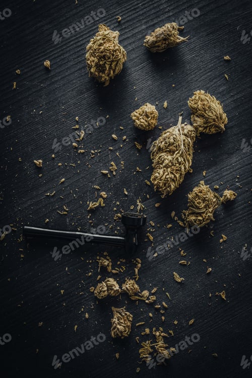 Preview: Dry CBD cannabis with metal smoking pipe