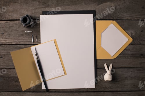 Preview: composition of blank papers for invitations on dark wooden table