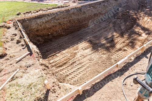 Preview: Freshly Dug Hole In Yard Preparing For Swimming Pool Installation