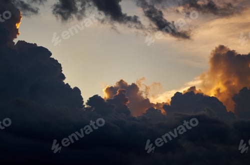 Preview: A dark cloud with a sunset in the clouds
