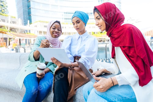 Preview: Beautiful muslim girl wearing hijab bonding outdoors
