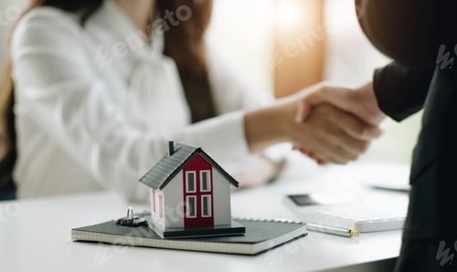 Preview: construction worker shaking hands with customer after finishing up business meeting to start up
