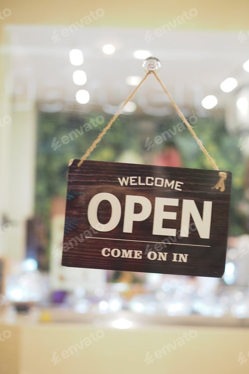 Preview: Open sign hanging in welcoming shop interior