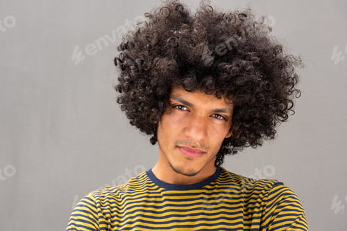 Preview: Close up handsome young man with afro staring