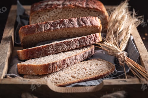 Preview: Healthy loaf of breads with grain and ears.