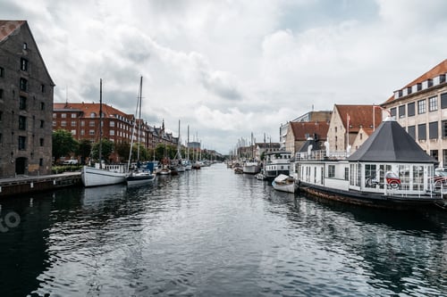Preview: Port of Copenhagen with old ships a cloudy summer day, Denmark .