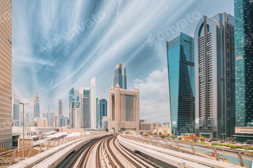 Preview: Metro road among glass skyscrapers in Dubai. Metropolitan railway among modern glass skyscrapers in