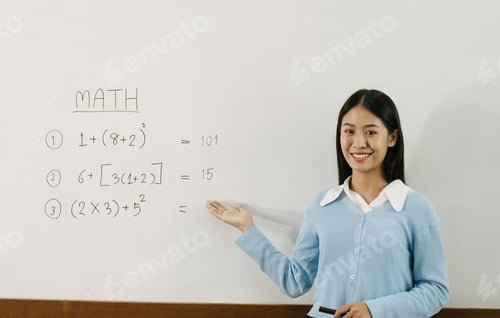 Preview: teacher is teaching students at the classroom while pointing at numbers