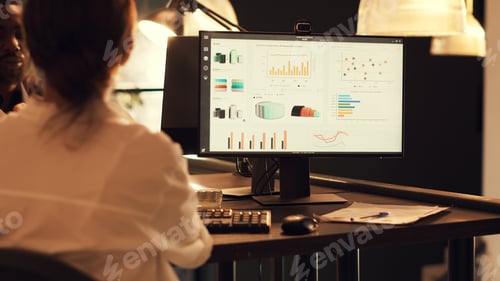 Preview: Startup employee analyzing company diagrams on computer
