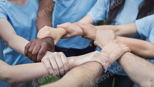 Preview: Hands of young people joined in circle