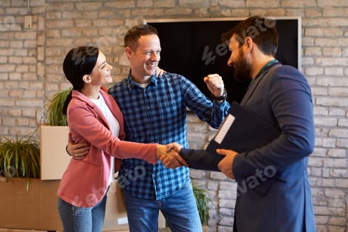 Preview: Young couple buying a new home from the sales agent