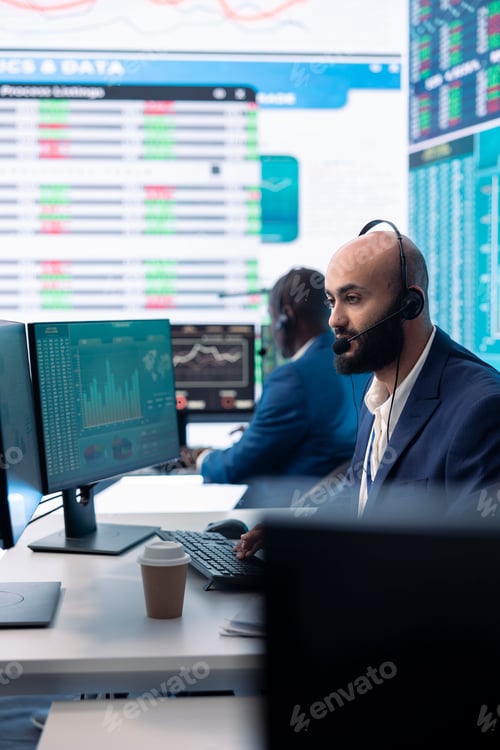 Preview: Focused team leader examining company numbers to calculate profit