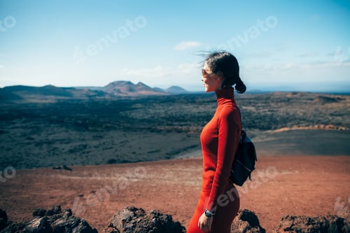Preview: Young woman enjoy unique volcanic landscapes in Canary island