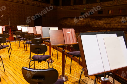 Preview: Music books and sheets with musical notation on the stands ready to the concert. Equipment of the