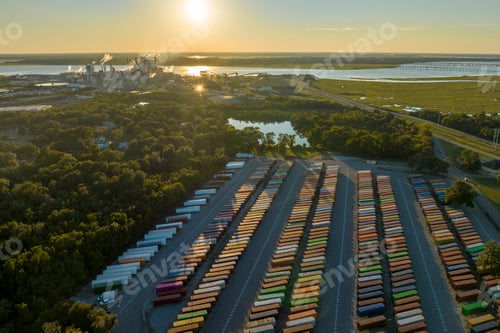 Preview: Large cargo container yard with many freight containers and big factory manufactory