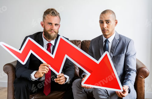 Preview: Two businessman sitting on a couch