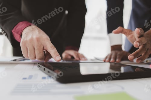 Preview: Businessman is reviewing monthly sales documents for analysis and marketing plans for more sales gro