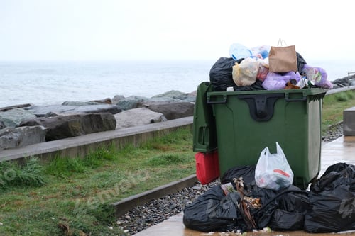 Preview: Full dumpsters garbage containers standing ear sea. Environmental, Ecology. Zara bag