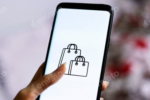 Preview: Closeup of a female holding phone with a shopping app
