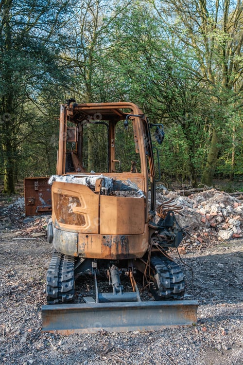 Preview: Burnt out construction digger by thieves.