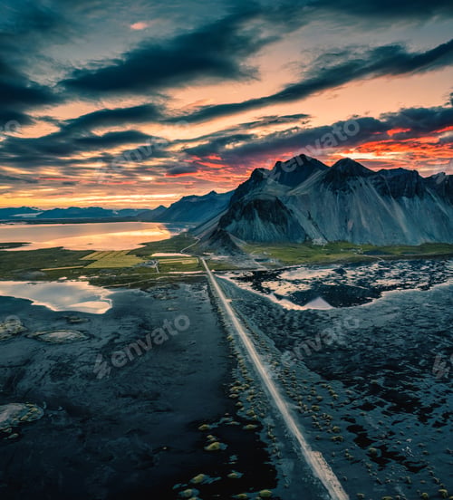 Preview: Vestrahorn mountain and road among black sand beach in the sunset at Stokksnes, Iceland
