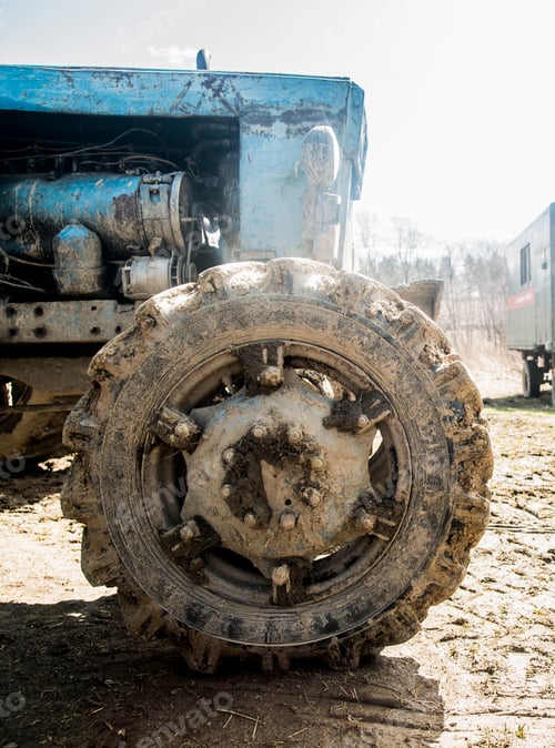 Preview: Close up of old rustic tractor in farmyard