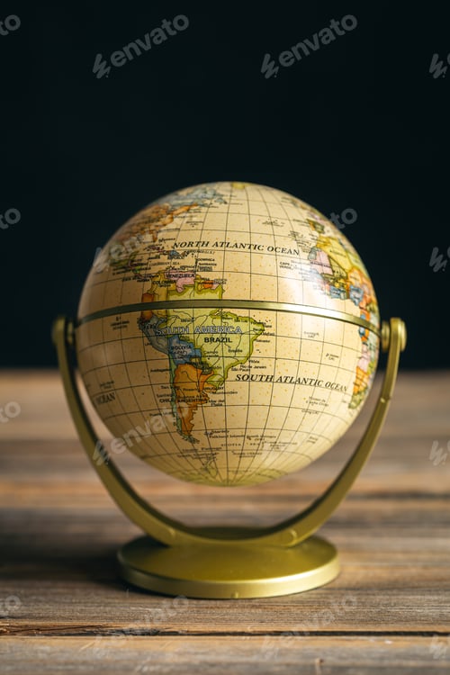 Preview: Earth globe on a wooden surface, close-up.