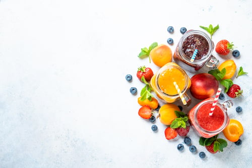 Preview: Smoothie with fresh fruits and berries at white background.