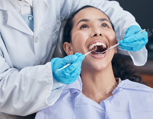 Preview: Shot of a young woman having a procedure performed by her dentist