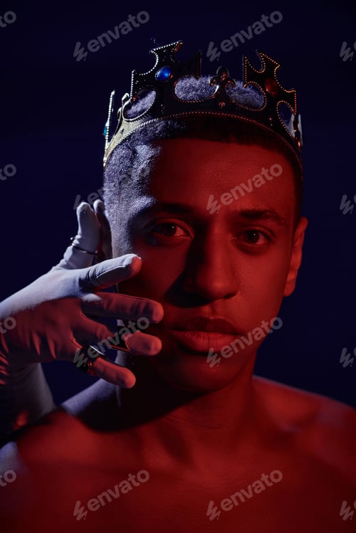 Preview: female hand in white glove with rings near face of shirtless african american man with crown