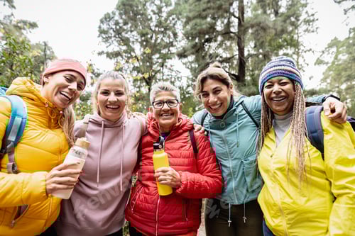 Preview: Group of women with different ages and ethnicities having fun walking in the woods