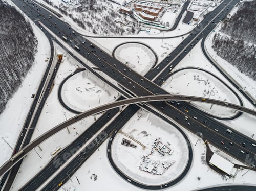 Preview: Aerial view of a freeway intersection Snow-covered in winter.