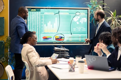 Preview: Account executive team examining trends to help make important decisions
