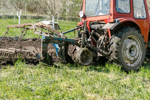 Preview: tractor plowing agricultural field meadow at farm cultivating make soil tillage seeding plants crops