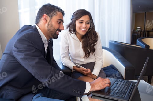 Preview: Business couple with computer