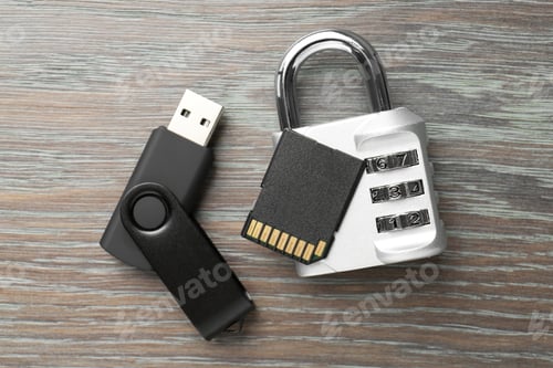 Preview: Flash drive, SD memory card and combination padlock on wooden background, flat lay