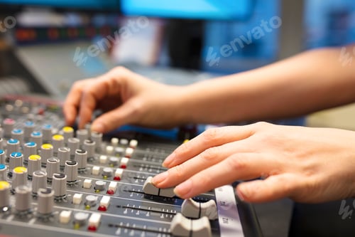 Preview: Female Radio Host Using Music Mixer In Studio