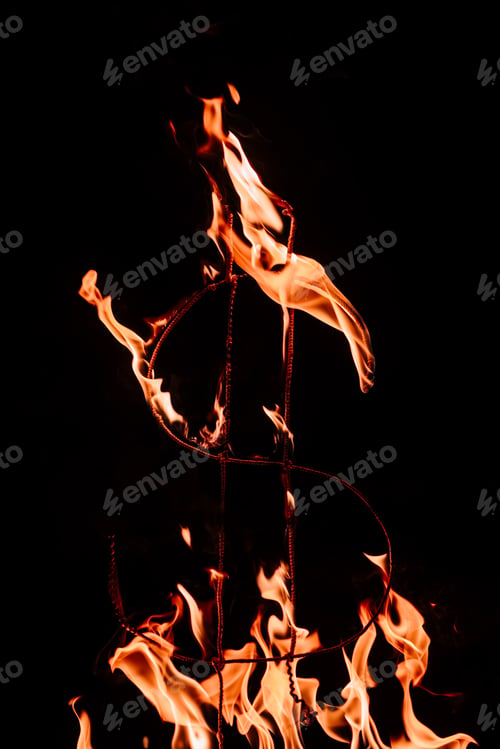 Preview: close up view of burning dollar sign isolated on black