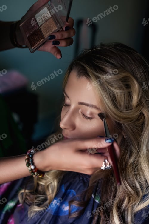 Preview: Beauty Preparation Taking Place in a Cozy Indoor Space With Skilled Hands at Work