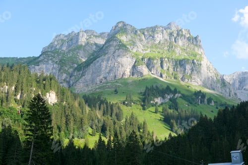 Preview: Beautiful landscape of the Alps forests and mountains on a sunny day - great for wallpapers